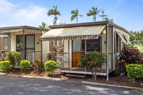 a house with a corrugated metal roof at First City Caravilla in Cairns