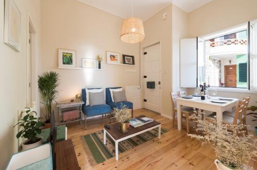 a living room with a table and a dining room at Porto D'Ouro Apartment in Porto