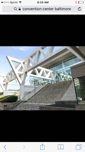 a picture of a convention center building with stairs at Cozy Rowhouse Next JHH in Baltimore
