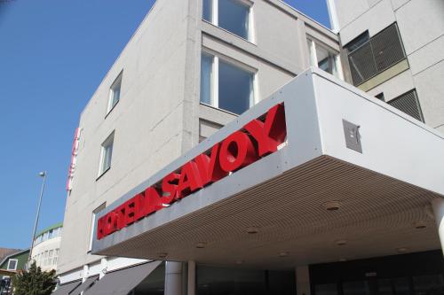 a red sign on the front of a building at Hotel Savoy in Mariehamn
