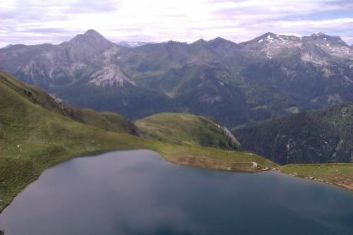 an aerial view of a lake in the mountains at Biobauernhof Tonimörtl in Mariapfarr