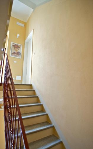 a stairwell in a building with a stair case at Locanda della Maria in Bellagio