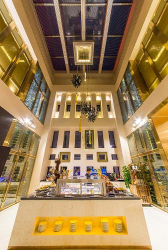a building with windows and a counter with yellow bowls at Radisson Blu Hotel Liuzhou in Liuzhou