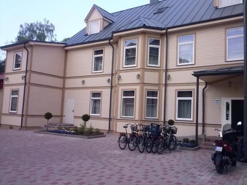 a group of bikes parked in front of a building at Dzintars Hotel in Jūrmala