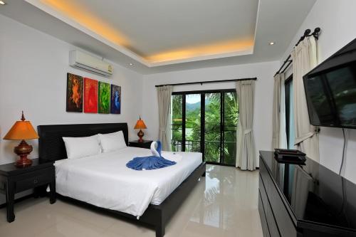 Katil atau katil-katil dalam bilik di Thaimond Residence by TropicLook Walkable distance to Naiharn beach