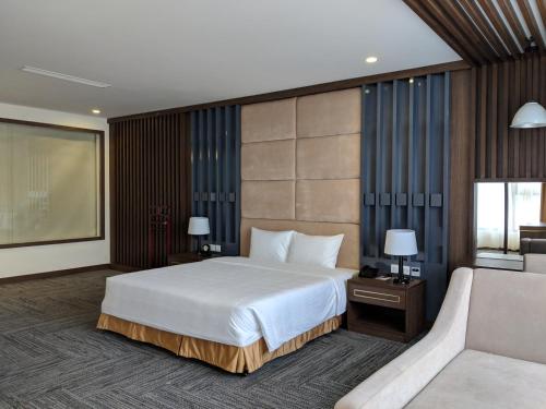 Giường trong phòng chung tại Muong Thanh Luxury Son La