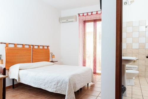 Ένα ή περισσότερα κρεβάτια σε δωμάτιο στο La Mezzanella Guesthouse