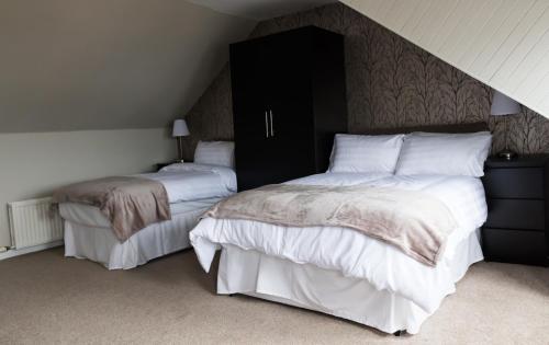 Ένα ή περισσότερα κρεβάτια σε δωμάτιο στο Harbourlights Accomodation