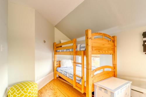a bedroom with two bunk beds in a attic at Sea At Last in Phippsburg