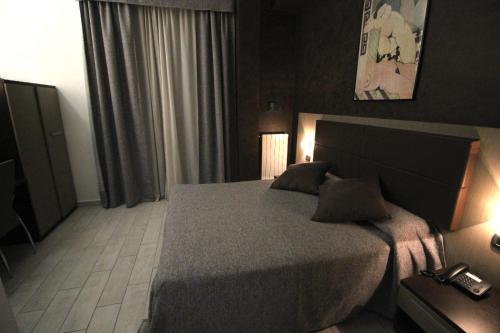 Een bed of bedden in een kamer bij Hotel Charter