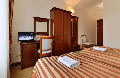 Ένα ή περισσότερα κρεβάτια σε δωμάτιο στο Hotel uluBIOny