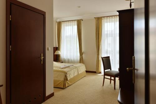 Ліжко або ліжка в номері Hotel uluBIOny