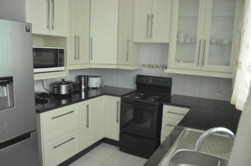Una cocina o cocineta en MYSECONDHOME