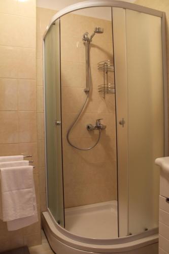 a shower with a glass door in a bathroom at Villa Marija in Marina