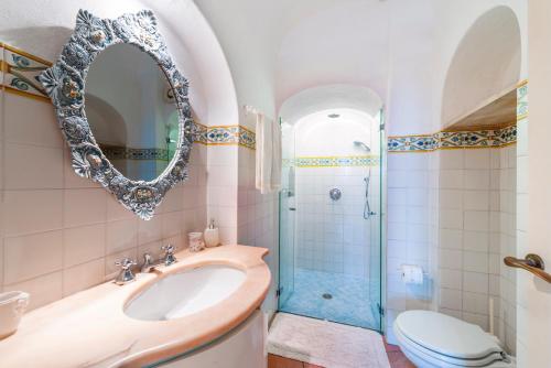 a bathroom with a sink and a shower at Casa Claudius - Positano in Positano
