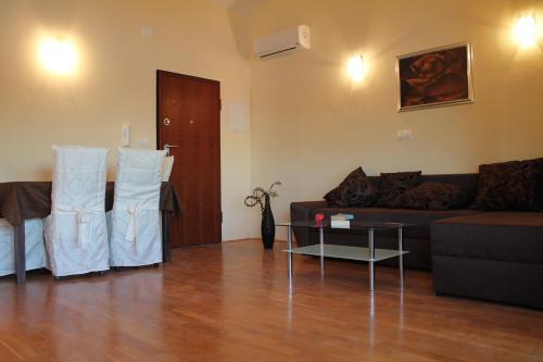 a living room with a couch and a table at Villa Marija in Marina