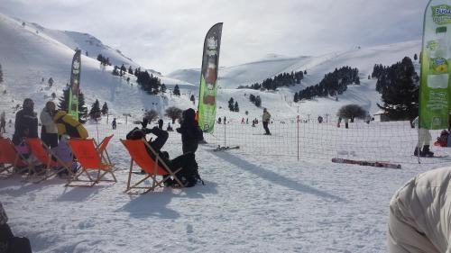 a group of people sitting in chairs in the snow at HOUSE SUITES DOMAINE in Rizómilos