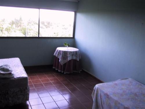 a room with a table in the corner with a window at Dre Broeders Apartments Juan Dolio in Juan Dolio