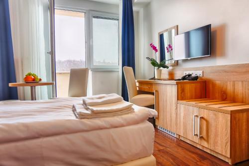 Ensana Spa Smrdákyにあるテレビまたはエンターテインメントセンター