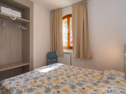Tempat tidur dalam kamar di Semi-detached and spacious bungalow on the Adriatic coast