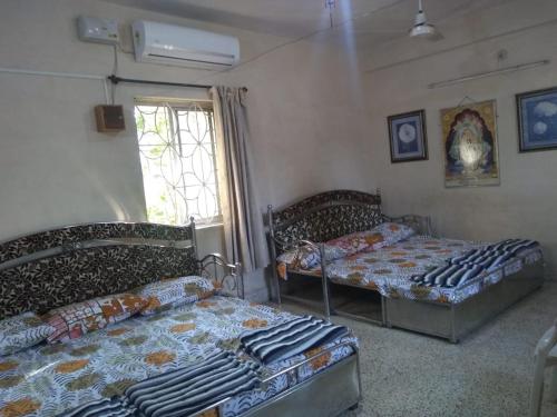 Voodi või voodid majutusasutuse Stay Goa toas