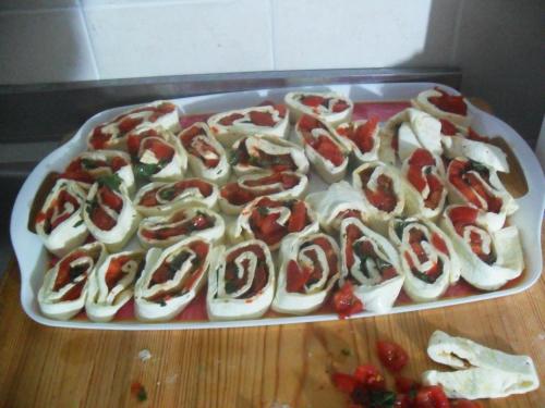 a tray filled with hot dogs on top of a table at La Vecchia Taverna B&B in Prignano Cilento