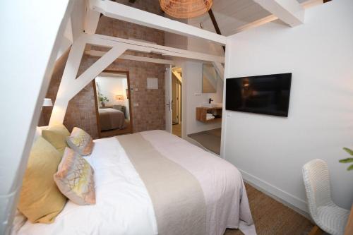 Postel nebo postele na pokoji v ubytování Hotel 't Fnidsen