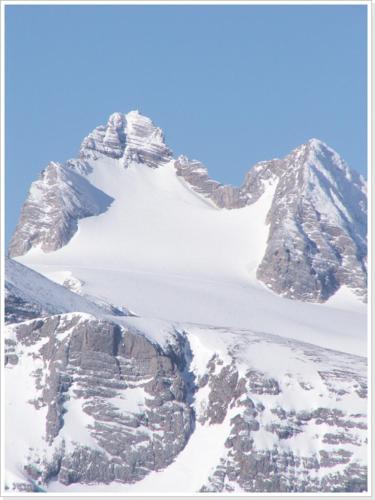 a snow covered mountain with a snow covered mountain at Ferienwohnung Haus Einhirn in Altaussee