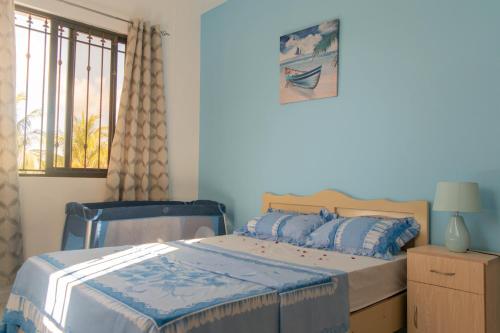 En eller flere senge i et værelse på Fantasea Villa - Mont Choisy