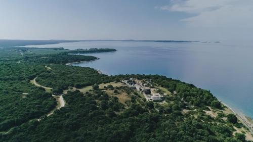 an aerial view of a house on an island in the water at Apartment Castel in Bale