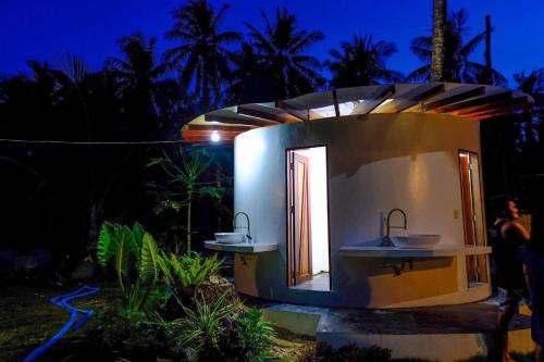 a building with two sinks in front of it at Dahun Villas Siargao in General Luna