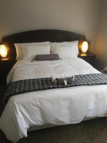 Katil atau katil-katil dalam bilik di Cape Pine Guest House