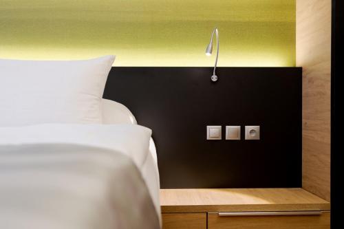 Postel nebo postele na pokoji v ubytování Expo Hotel