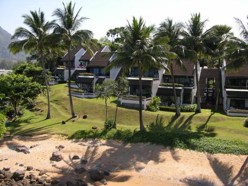 an aerial view of a resort with palm trees at Kamala Beach Estate Resort - SHA Extra Plus in Kamala Beach