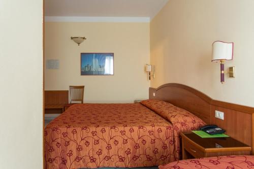 Postel nebo postele na pokoji v ubytování Hotel Ristorante Paladini