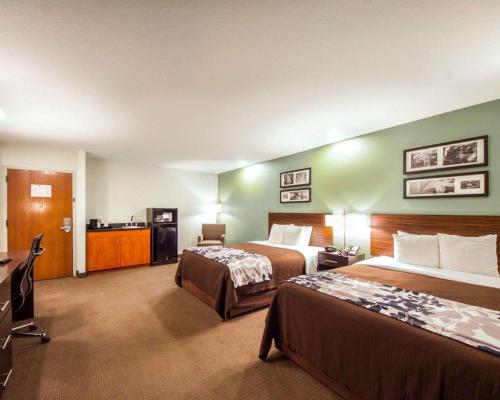 Voodi või voodid majutusasutuse Sleep Inn & Suites Edmond near University toas