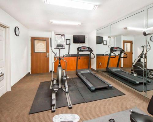 a gym with two exercise bikes in a room at Sleep Inn & Suites Edmond near University in Edmond