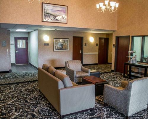a lobby with couches and chairs in a hotel at Comfort Suites Portland Southwest in Portland