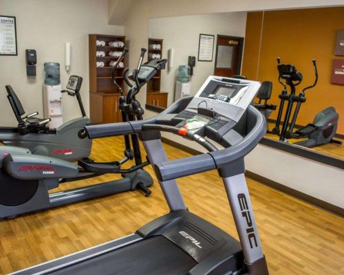 a gym with a treadmill and other exercise equipment at Comfort Suites Portland Southwest in Portland