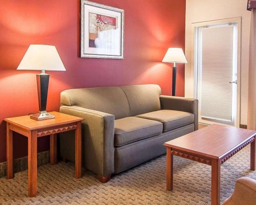 a living room with a couch and a table at Comfort Suites Redmond Airport in Redmond