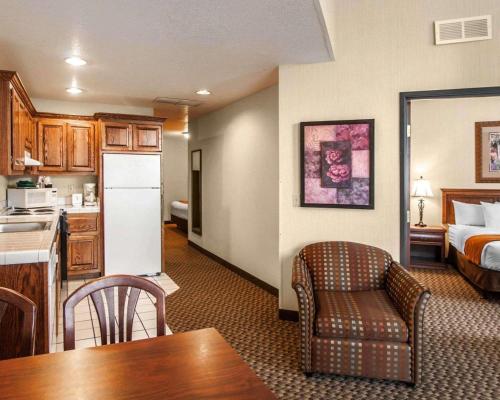 a hotel room with a kitchen and a living room at Comfort Suites Corvallis in Corvallis