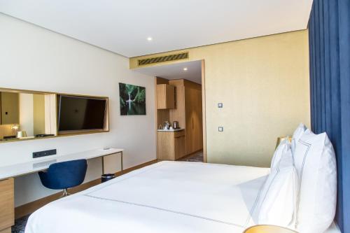 Voodi või voodid majutusasutuse Swissotel Sarajevo toas