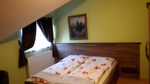 Postel nebo postele na pokoji v ubytování Penzión Hubert Levoča