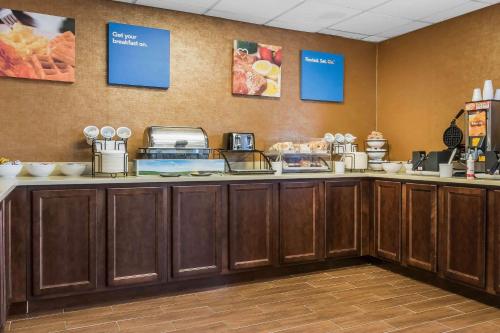 a kitchen with a counter with food on it at Comfort Inn Pine Grove I-81 Hershey Area in Pine Grove