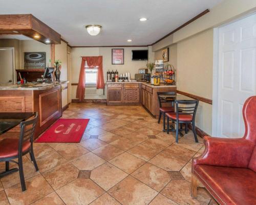 a large room with a kitchen with a table and chairs at Econo Lodge in Hermitage