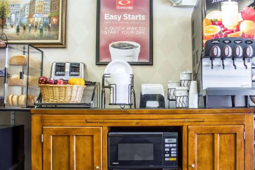 a microwave on top of a counter in a store at Econo Lodge Meadville in Meadville