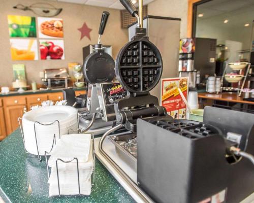 a kitchen counter with a mixer and dishes on it at Quality Inn New Columbia-Lewisburg in New Columbia