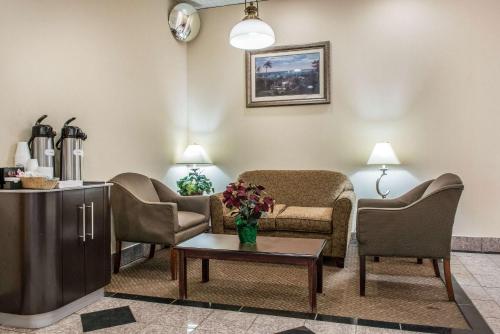 a waiting room with couches and a coffee table at Quality Inn & Suites in Fairview