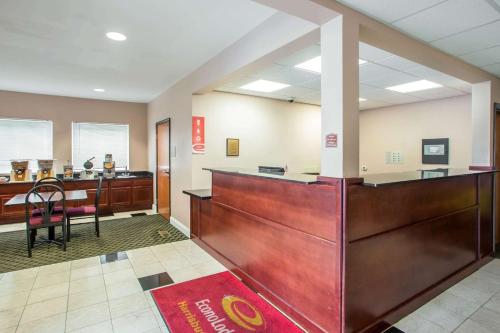 a law office with a reception desk and a bench at Econo Lodge Harrisburg - Hershey in Harrisburg
