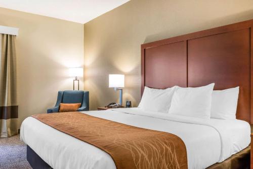 A bed or beds in a room at Comfort Inn